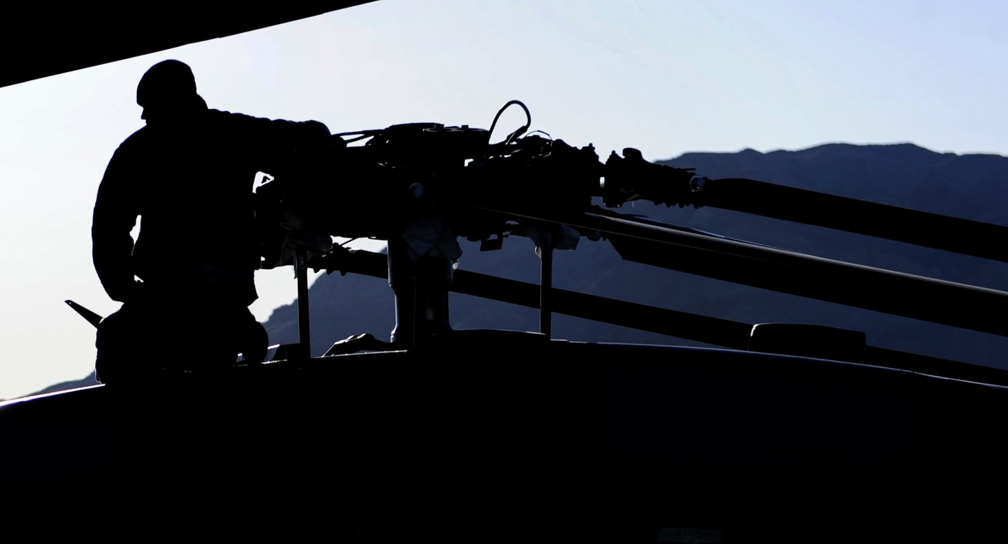 An Airman helps guide the rotor of an HH-60 Pave Hawk assigned to the 34th Weapons Squadron, as it is loaded onto a C-17 Globemaster III assigned to the 57th Weapons Squadron, McChord Air Force Base, Wash., March 28, 2017. The C-17 was traveling to Fort Riley, Kan. for training. (U.S. Air Force photo by Airman 1st Class Kevin Tanenbaum/Released) 