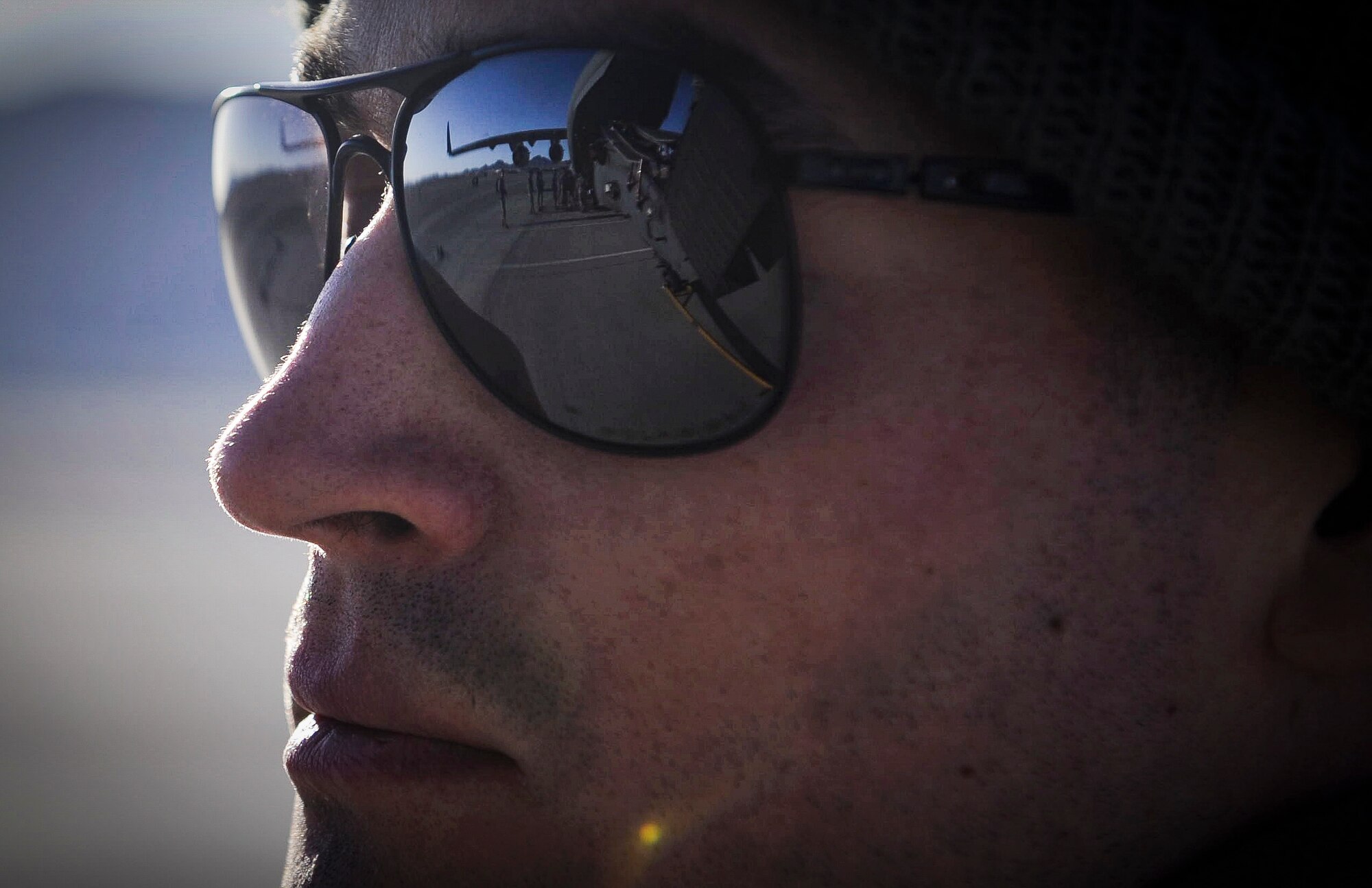 An Airman, 34th Weapons Squadron, watches an HH-60 Pave Hawk being loaded onto a C-17 Globemaster III, assigned to the 57th Weapons Squadron, McChord Air Force Base, Wash., before departing for training at Fort Riley, Kan., March 28, 2017. The primary mission of the HH-60G Pave Hawk helicopter is to conduct day or night personnel recovery operations into hostile environments to recover isolated personnel during war. (U.S. Air Force photo by Airman 1st Class Kevin Tanenbaum/Released) 