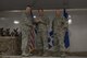 Col. Shane Barrett, 23d Maintenance Group commander, left, awards retired Chief Master Sgt. Darryl Gagne, 23d Force Support Squadron education specialist, center, with a token of appreciation for his participation as the guest speaker during the 2016 Maintenance Professional of the Year banquet, March 31, 2017, at Moody Air Force Base, Ga. During the event, the 23d MXG honored 28 Airmen for their exceptional service.  (U.S. Air Force photo by Airman 1st Class Lauren M. Sprunk)