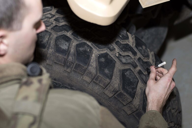 Senior Airman Michael Ripple, 791st Missile Security Forces Squadron response force leader, checks the tread depth on a Humvee at Minot Air Force Base, N.D., Mar. 28, 2017. The tires air pressure was also checked to help maintain vehicle performance. (U.S. Air Force photo/Airman 1st Class Austin M. Thomas)