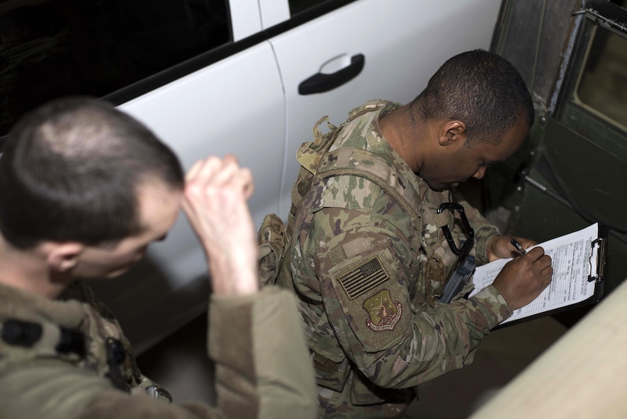 Senior Airman Michael Ripple, 791st Missile Security Forces Squadron response force leader and Staff Sgt. Calvin Smith, 91st Missile Security Force Squadron flight security controller, review a pre-mission vehicle checklist at Minot Air Force Base, N.D., Mar. 28, 2017. Vehicle checks help prevent breakdowns and identify other potential problems. (U.S. Air Force photo/Airman 1st Class Austin M. Thomas)