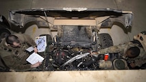 Senior Airman Michael Ripple, 791st Missile Security Forces Squadron response force leader, and Staff Sgt. Calvin Smith, 91st Missile Security Force Squadron flight security controller, inspect the engine of a Humvee at Minot Air Force Base, N.D., Mar. 28, 2017. To ensure a vehicles longevity, Airmen performed a detailed inspection before going out to the field. (U.S. Air Force photo/Airman 1st Class Austin M. Thomas)