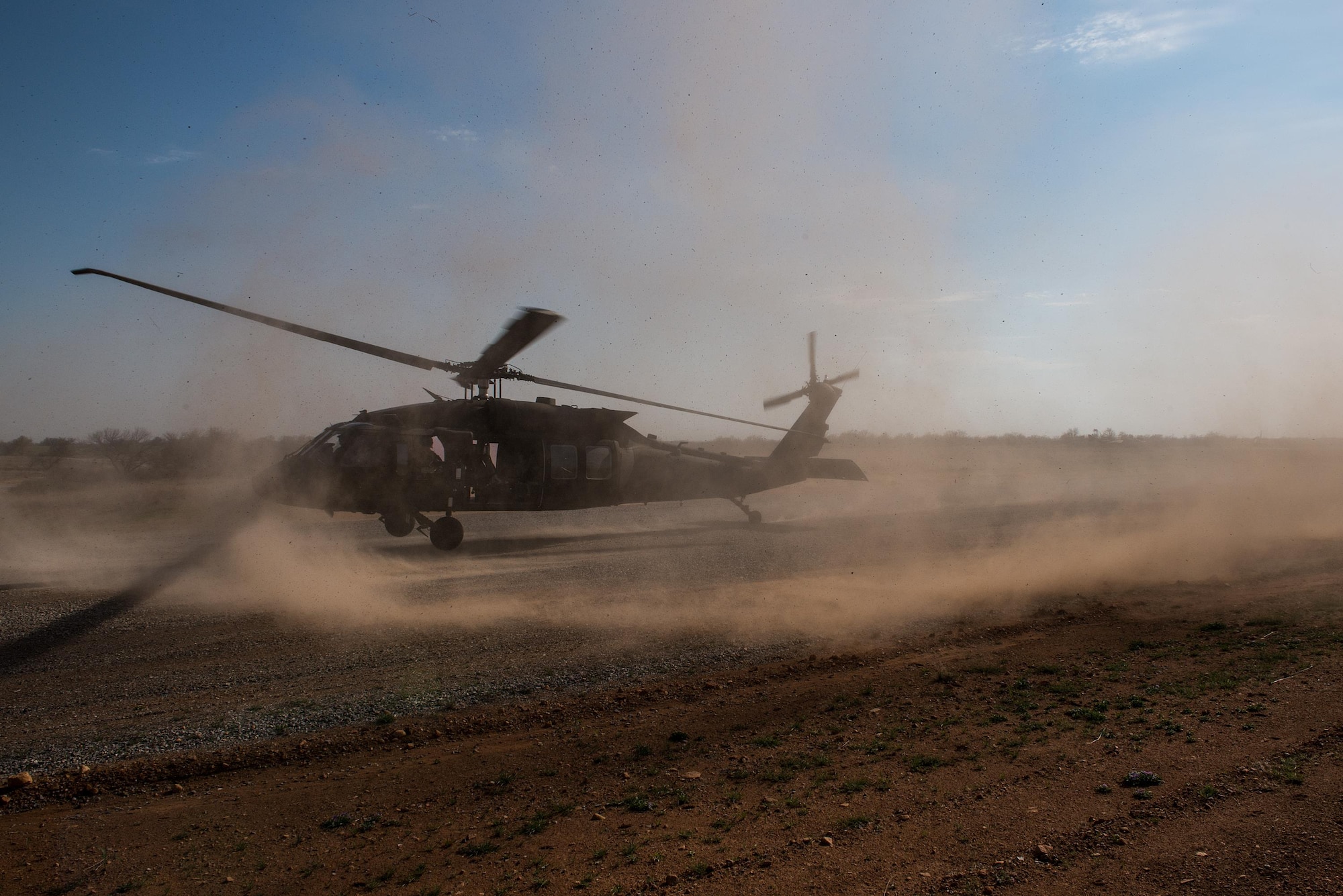 A UH-60 Black Hawk helicopter prepares to land and extract Special Tactics Airmen for the 123rd Special Tactics Squadron, Kentucky Air National Guard, and one Public Affairs Airman from Falcon Bombing Range, Fort Sill, Okla., March 22, 2017. The 137th Air Support Element from the 137th Special Operations Wing, Oklahoma City, coordinated a joint training event with the 123rd Special Tactics Squadron, Kentucky Air National Guard, Air Force Reserve F-16 Fighting Falcons from the 301st Fighter Wing and T-38 Talons from the 88th Fighter Training Squadron, Sheppard Air Force Base, March 20-23, 2017. (U.S. Air National Guard photo by Senior Master Sgt. Andrew M. LaMoreaux/Released)
