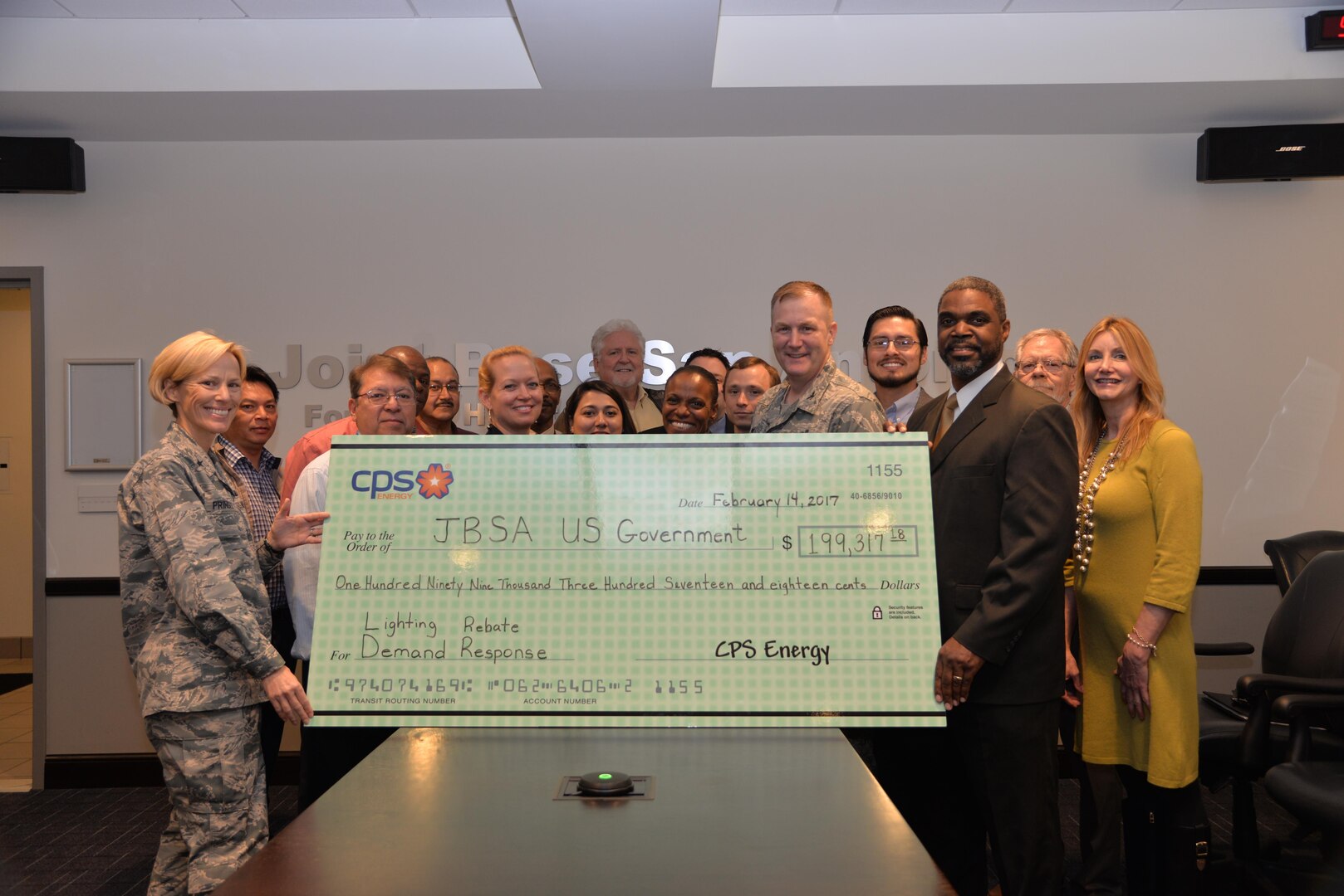 Members of the 502nd Civil Engineer Squadron and CPS Energy present (left) Brig. Gen Heather Pringle, 502nd Air Base Wing and Joint Base San Antonio commander, a rebate check from CPS Energy’s Demand Response Program Feb. 14, 2017, at JBSA-Fort Sam Houston, Texas. Peak demand reduction programs reduce utility costs to JBSA installations and improve energy efficiency with an estimated annual savings of $530,000. 