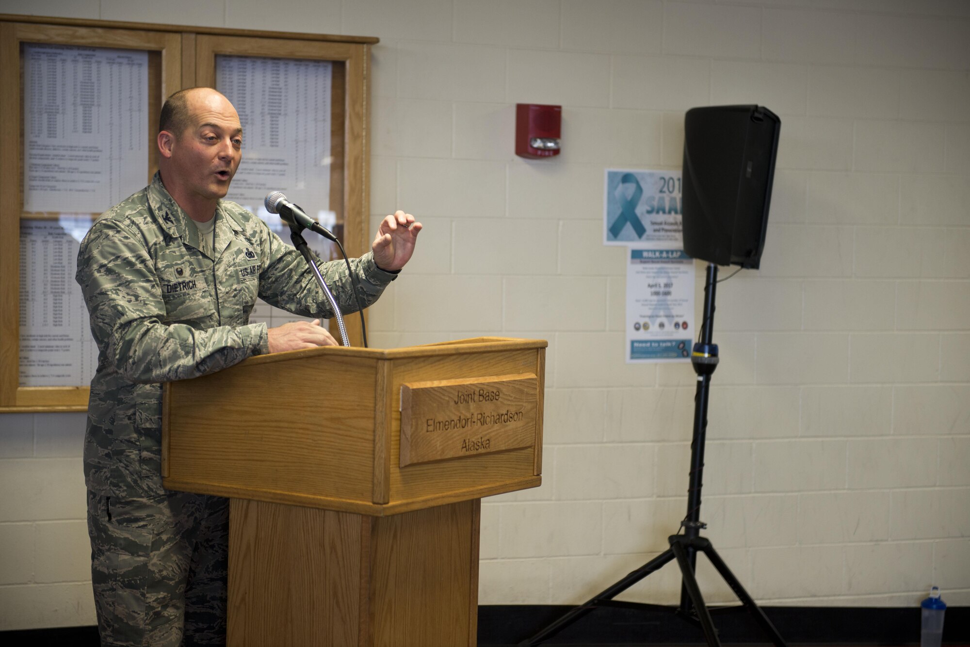 Air Force Col. George T.M. Dietrich III speaks at the Sexual Assault Prevention and Response Walk-A-Lap event, March 5 in the Elmendorf Fitness Center. Dietrich walked his own laps after his speech. 