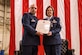 Col. Anthony Esposito, left, the 514th Maintenance Group commander presents Chief Master Sgt. Linda L. Menser, the 514th Maintenance Group chief enlisted advisor and superintendent, her Retirement Certificate during the chief’s retirement ceremony at the 514th Air Mobility Wing, Joint Base McGuire-Dix-Lakehurst, N.J., April 2, 2017. As the Group superintendent, Menser was the Maintenance Group commander’s advisor on all matters concerning the health, morale, welfare, and effective management of 102 Air Reserve Technicians and 500 reserve enlisted members. Menser was also the first 514th Maintenance superintendent who was a woman. (U.S. Air Force photo by Master Sgt. Mark C. Olsen/Released)