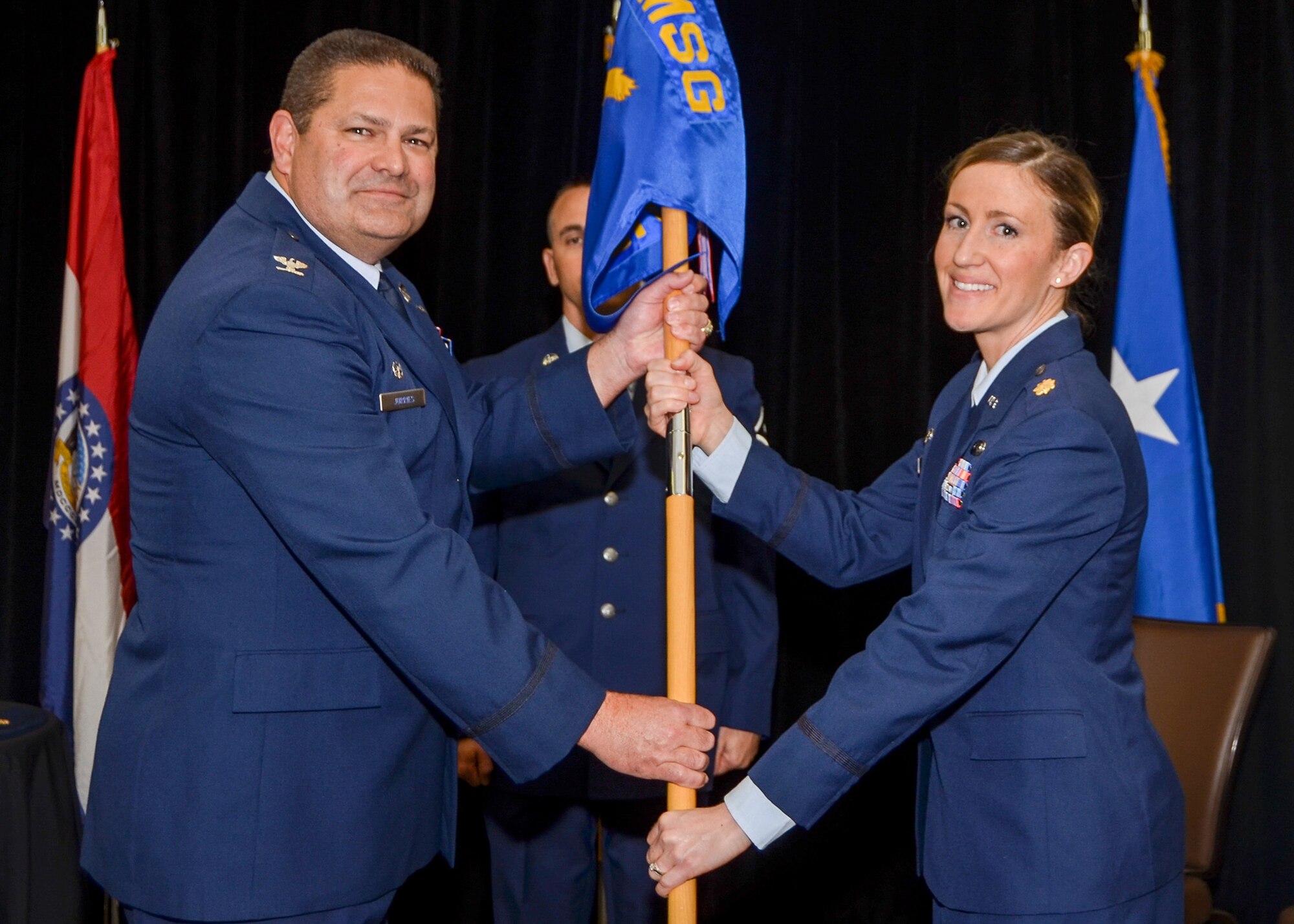Maj. Rachel Savage receives the 131st Logistics Readiness Squadron guidon from Col. Michael Jurries, 131st Mission Support Group commander, during the assumption of command ceremony at Whiteman Air Force Base, Missouri, April 1, 2017. (U.S. Air National Guard photo by Tech. Sgt. Traci Howells)