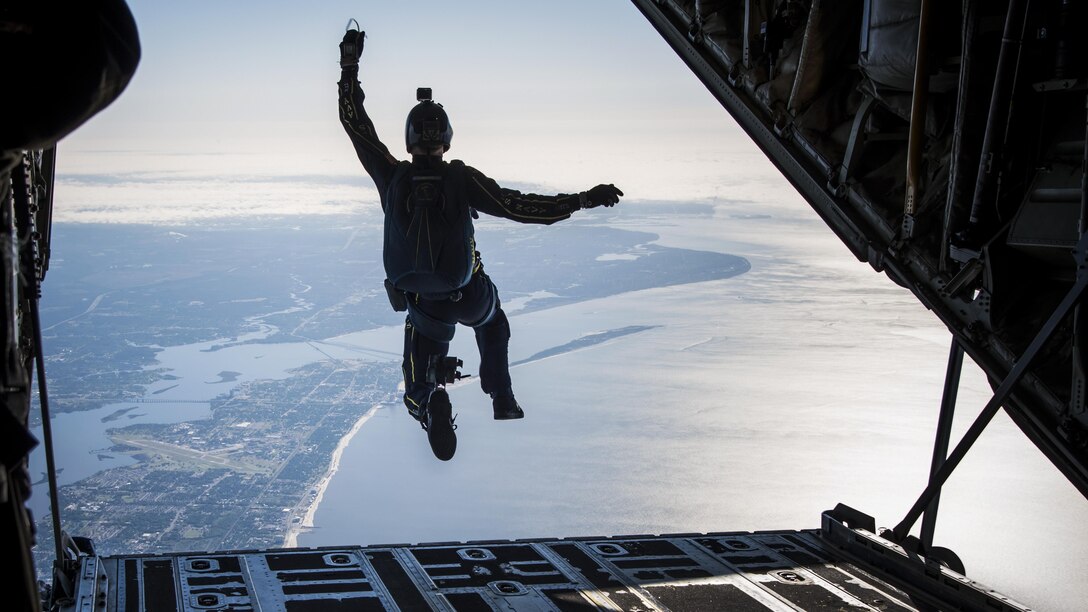 A member of the Leap Frogs, the Navy's parachute demonstration team, jumps from a C-130J Super Hercules aircraft near Keesler Air Force Base, Miss., April 4. The aircraft is assigned to the 815th Airlift Squadron. The Navy coordinated with the squadron to conduct several jumps during joint training. Air Force photo by Staff Sgt. Heather Heine
