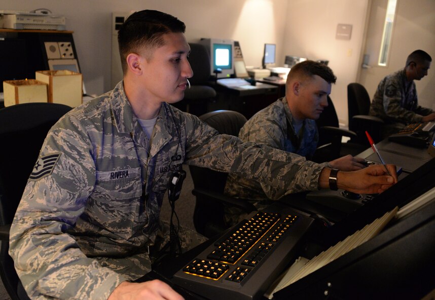 Tech. Sgt. Ruben Rivera, 60th Operations Support Squadron, monitors air traffic over Travis Air Force Base, Calif., inside the Travis Radar Approach Control facility April 3, 2017. Travis air traffic controllers monitor an average of 367 aircraft daily. (U.S. Air Force photo/Tech. Sgt. James Hodgman/Released)