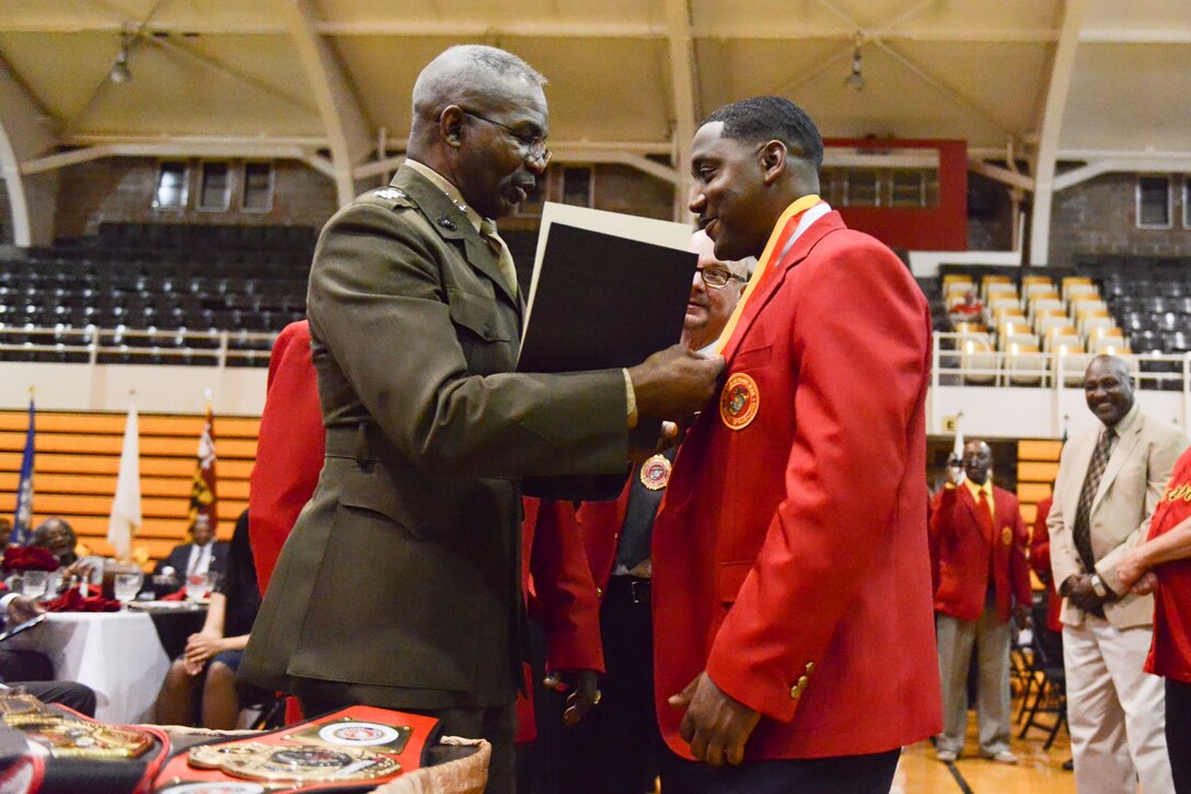 Sgt. Teddy Randolph Jr., medical administration non-commissioned officer in charge, Marine Forces Reserve, was inducted into the All-Marine Boxing Hall of Fame at Goettge Memorial Field House on Marine Corps Base Camp Lejeune, April 1, 2017. Randolph was formally inducted by Lt. Gen. Ronald L. Bailey, the Deputy Commandant for plans, policies, and operations. (Courtesy photo by Navy Media Content Services)