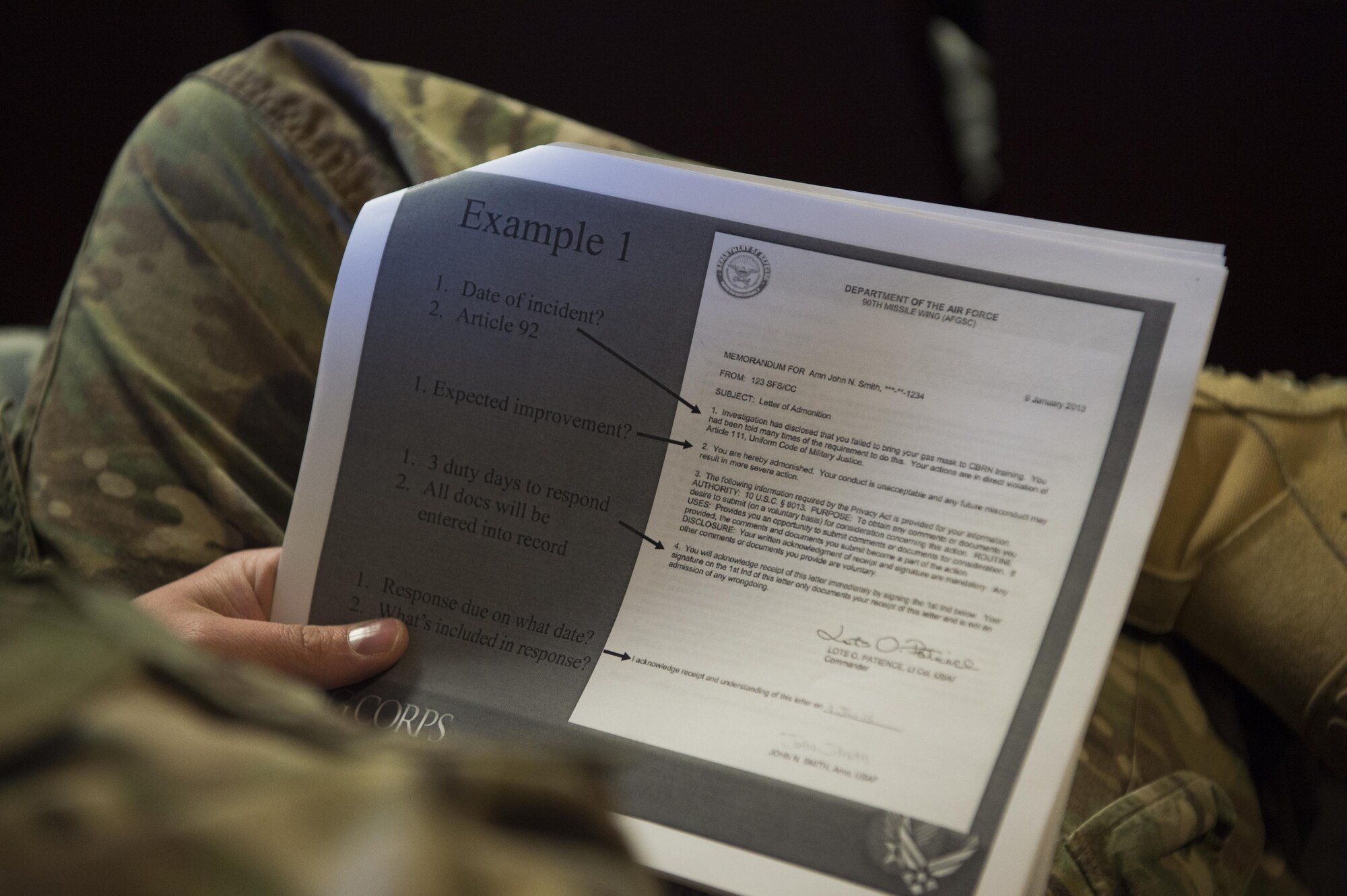 An Airman holds an informational handout during a Military Justice 101: Administrative Paperwork class at F.E. Warren Air Force Base, Wyo., April 5, 2017. The class covered topics such as writing letters of counseling and reprimand, and detailed the mistakes which are often made by supervisors and commanders. (U.S. Air Force photo by Staff Sgt. Christopher Ruano)