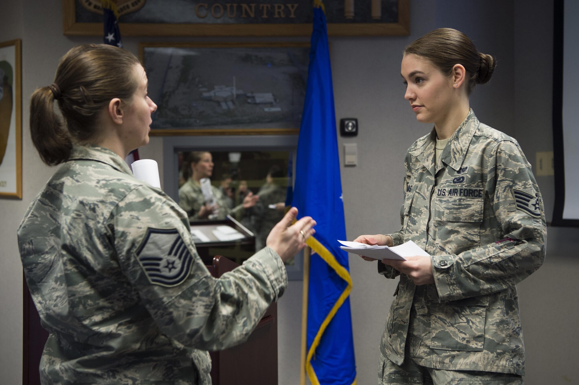 Staff Sgt. Jessica Thomas, 90th Missile Wing legal NCO in charge of military justice, answers additional questions after a Military Justice 101: Administrative Paperwork class at F.E. Warren Air Force Base, Wyo., April 5, 2017. More than 50 military members attended the class to discover the ins and outs of progressive discipline and writing effective administrative actions. (U.S. Air Force photo by Staff Sgt. Christopher Ruano)