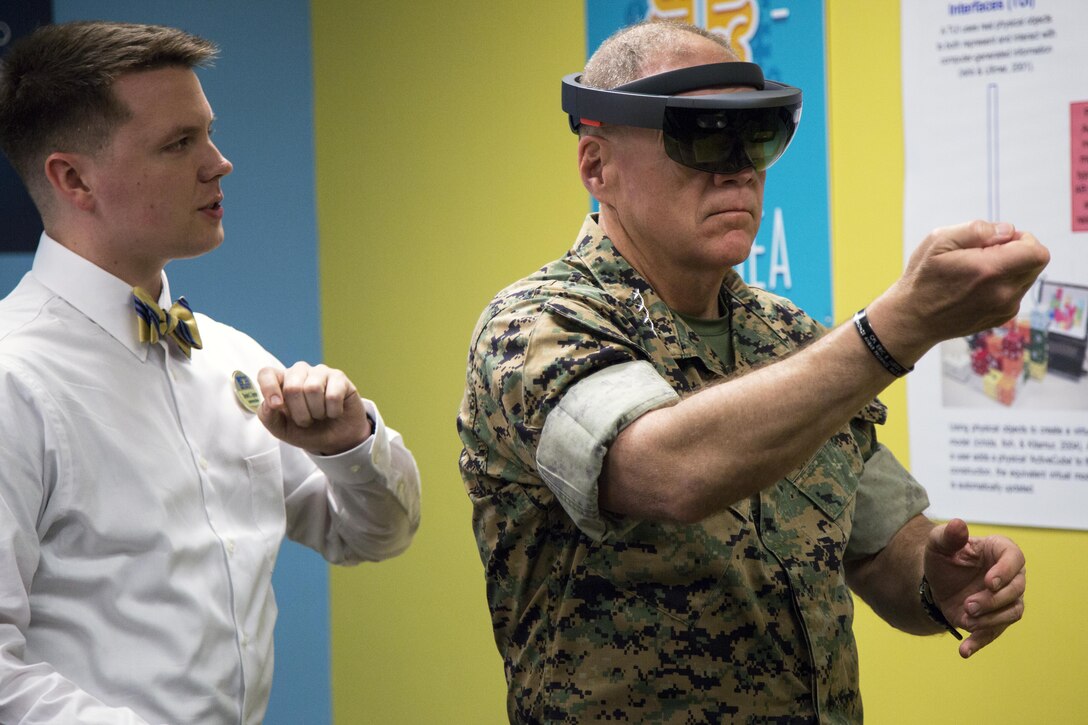 General Robert B. Neller, commandant of the Marine Corps, uses a HoloLens to manipulate virtual objects April 4 at the Marine Corps Installations Pacific Innovation Lab aboard Camp Foster, Okinawa, Japan. The HoloLens is a real time simulation where certain gestures move and open the simulation in different ways. (U.S Marine photo by Lance Corporal Tayler P. Schwamb)