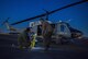 Aircrew walk through hoist training steps prior to a 459th Airlift Squadron night hoist training exercise April 4, 2017, at Yokota Air Base, Japan. The hoist allows the 459 AS to conduct rescue missions in small, tight areas throughout the Kanto Plains. (U.S. Air Force photo by Airman 1st Class Donald Hudson) 
