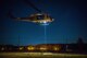 Capt. Lance M. Stafford, 36th Airlift Squadron pilot, is lifted into UH-N1 Iroquois during a 459th Airlift Squadron night hoist training exercise April 4, 2017, Tokyo, Japan. The aircrew performed hoist insertion and extraction from 25-35 feet above ground. (U.S. Air Force photo by Airman 1st Class Donald Hudson) 
