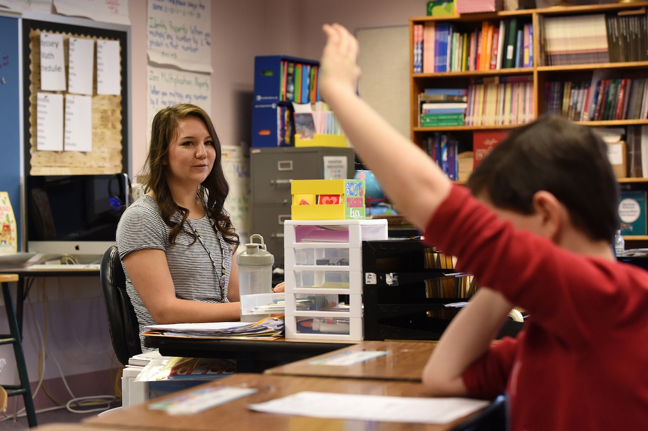 Staff Sgt. Megan Schreder, services craftsman for the 168th Force Support Flight, Alaska Air National Guard, Eielson AFB, Alaska, answers questions from students in her fifth-grade class at Arctic Light Elementary School, Fort Wainwright, Alaska, January, 30, 2017. Schreder, who used her military tuition assistance to pay for college, is in her second year of teaching elementary school students. 