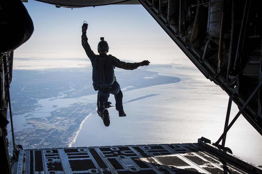 A member of the Leap Frogs, the Navy's parachute demonstration team, jumps from a C-130J Super Hercules aircraft near Keesler Air Force Base, Miss., April 4. The aircraft is assigned to the 815th Airlift Squadron. The Navy coordinated with the squadron to conduct several jumps during joint training.Air Force photo by Staff Sgt. Heather Heine