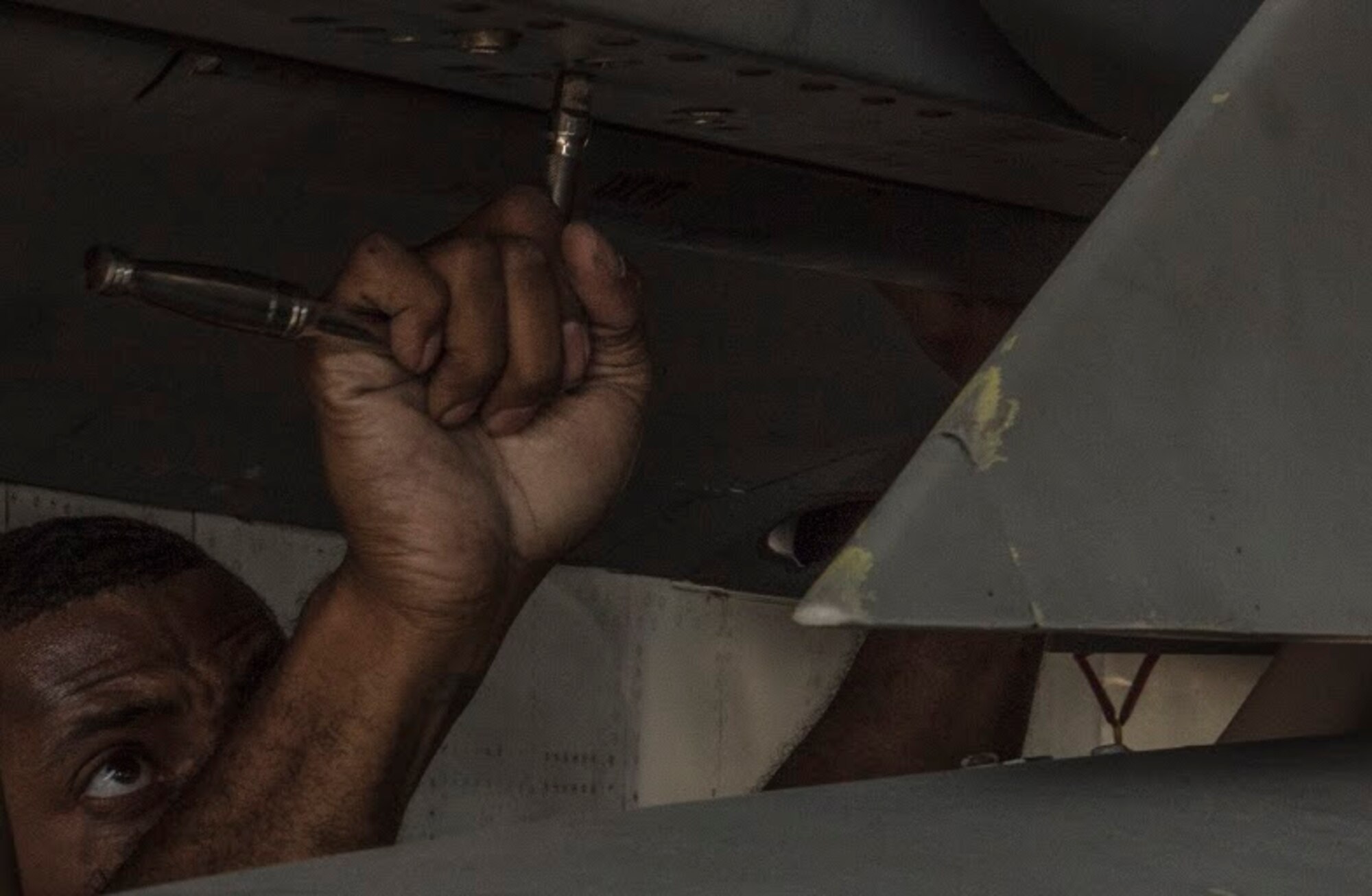 U.S. Air Force Staff Sgt. Jason Jones, 18th AMXS weapons load crew chief, secures an AIM-9L/M Sidewinder missile during a quarterly weapons load competition April 3, 2017, at Kadena Air Base, Japan. The competition brings together weapons load crew members from 44th and 67th Aircraft Maintenance Units of the 18th AMXS to compete against one another. (U.S. Air Force photo by Senior Airman Nick Emerick/Released)