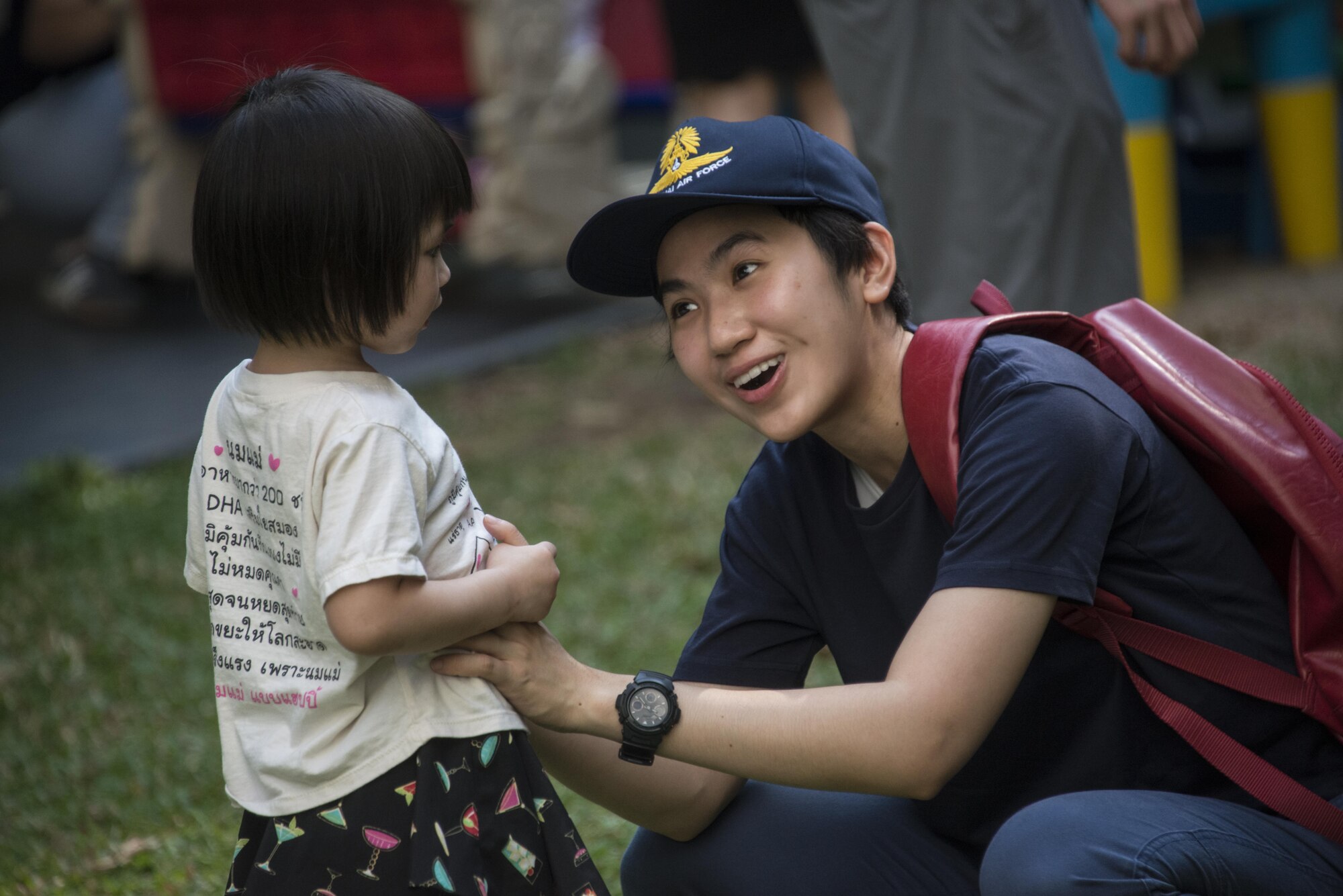A Royal Thai Air Force pilot assigned to the 601st Squadron plays with a child supported by the Thai Red Cross Children’s Home during a community relations event, March 11, 2017 in Bangkok, Thailand. Over $15,000 worth of goods to include computers, appliances, cribs, clothes and food were donated to support the children’s development. (U.S. Air Force photo by Capt. Jessica Tait)