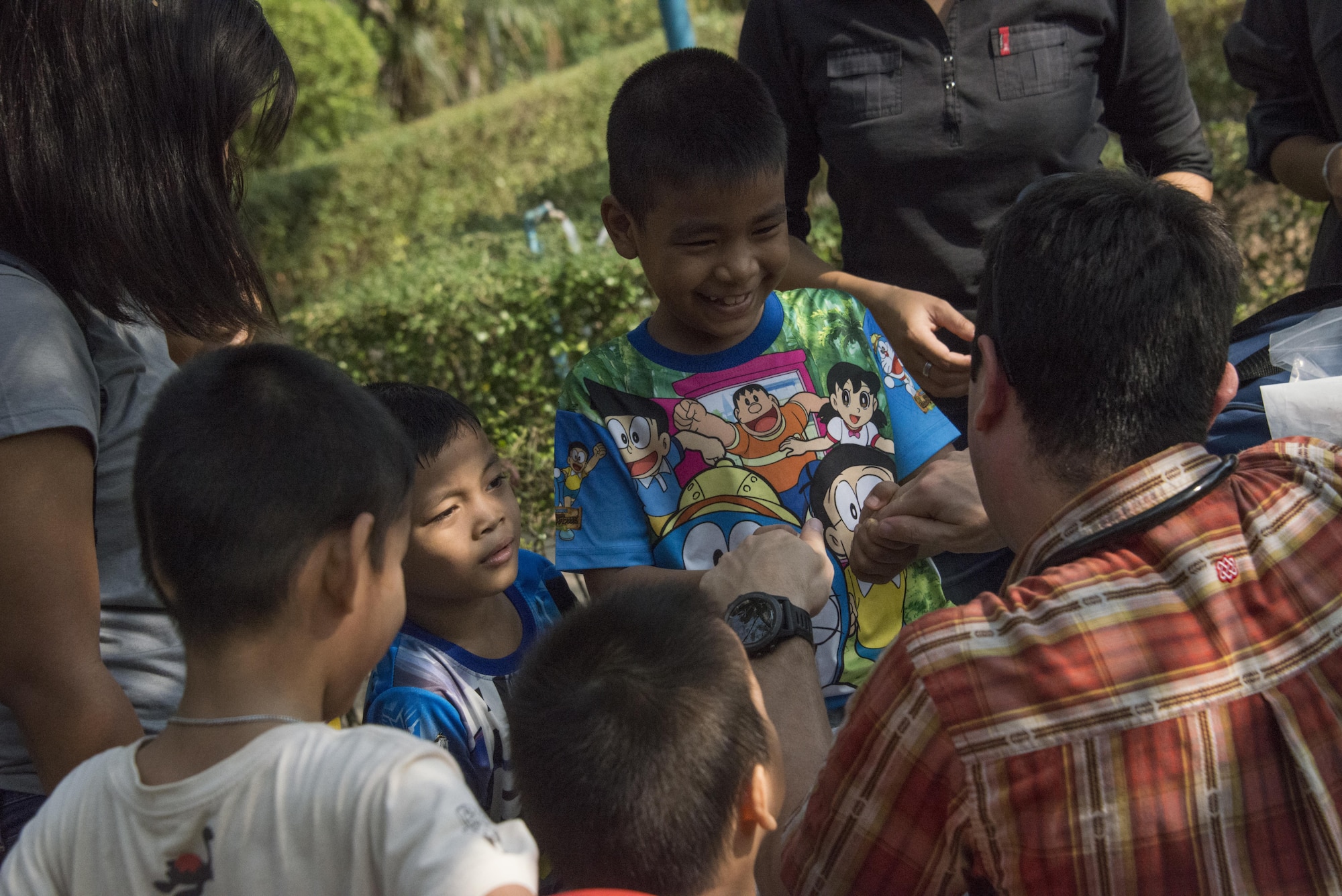 U.S. Air Force Capt. Nicholas Garcia, 353rd Special Operations Support Squadron flight doctor, provides medical care to children supported by Sparrow Home, a private, non-profit orphanage during a community relations event, March 12, 2017 in Bangkok, Thailand. The COMREL event during Teak Torch 2017 demonstrated the United States unwavering support and commitment to the security and humanitarian interests of one our greatest alleys and treaty partners. (U.S. Air Force photo by Capt. Jessica Tait)
