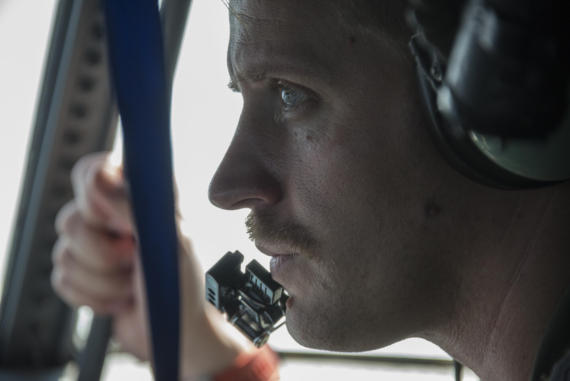 U.S. Air Force Maj. Casey Cunningham, 1st Special Operations Squadron evaluator navigator, looks out the window of a MC-130H Talon II during a full mission profile conducted by Royal Thai Air Force 3rd Battalion Special Operations Regiment and U.S. Air Force 6th SOS, March 16, 2017 at Prachuap Khiri Khan, Thailand. Air commandos from the 1st SOS supported the training operations of the RTAF 3rd BN SOR and U.S. Air Force 6th SOS during the last week of Teak Torch 2017. (U.S. Air Force photo by Capt. Jessica Tait)