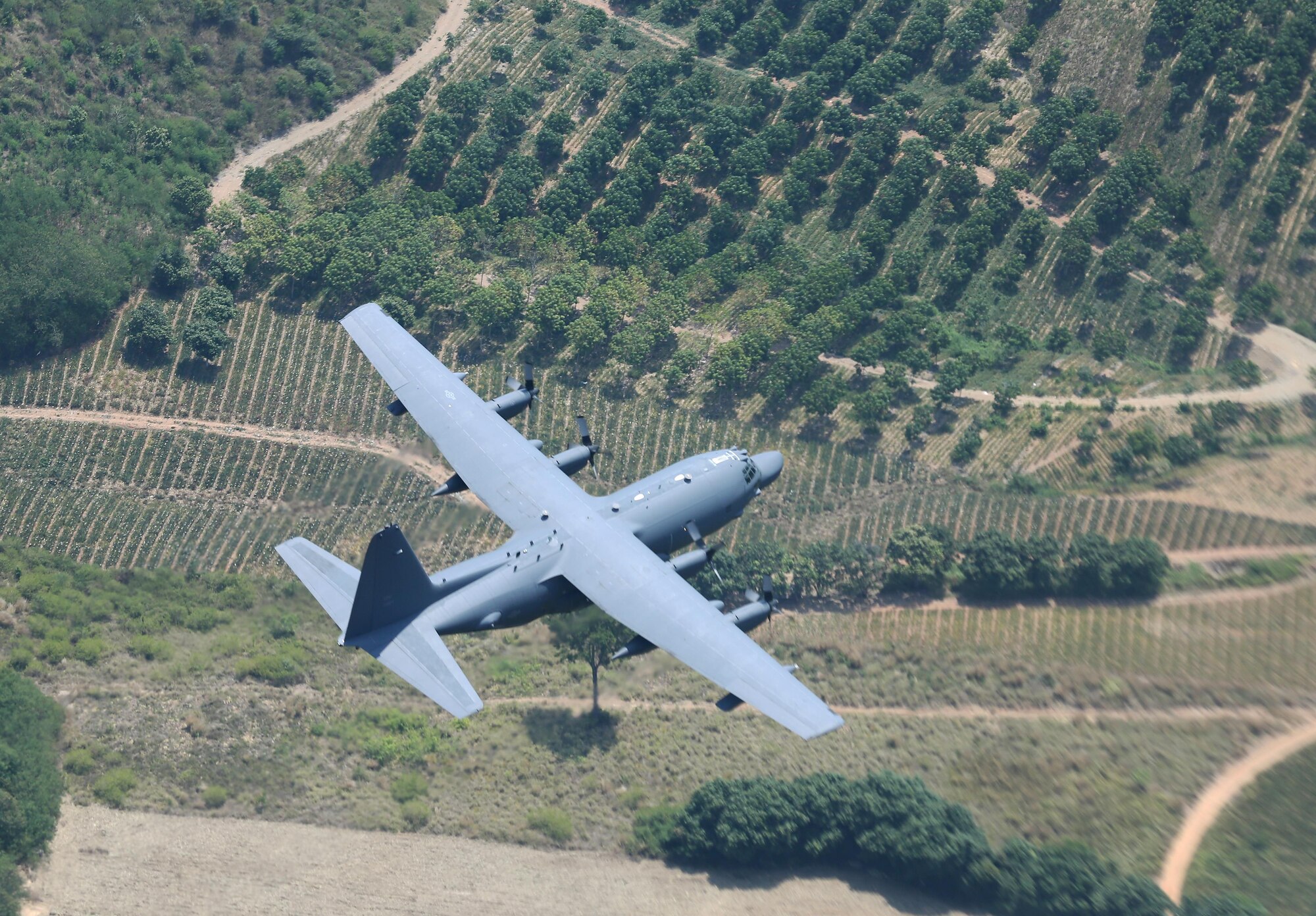 A U.S. Air Force MC-130H Talon II assigned to the 1st Special Operations Squadron flies visual formation with a Royal Thai Air Force C-130 assigned to the 601st Squadron, March 14, 2017 at Don Mueang Air Base, Thailand. A few first-ever engagements occurred during Teak Torch 2017 to include 353rd Special Operations Group members flying on a RTAF C-130, a U.S. and Thai formation flight and 353rd Special Operations Maintenance Squadron plugging a fuel quantity indicator test set into a Thai aircraft. (Courtesy photo by Royal Thai Air Force Public Affairs)