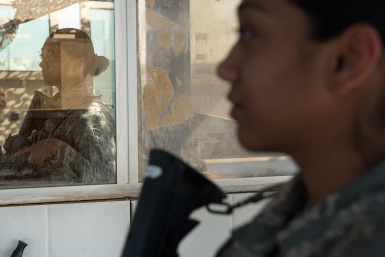 Airman 1st Class Gracie Martinez, 407th Expeditionary Security Forces Squadron, stands watch at an entry control point at the 407th Air Expeditionary Group, March 28, 2017. The security forces squadron is responsible for security of U.S. Air Force, Marine, coalition and host-nation assets.  (U.S. Air Force photo/Master Sgt. Benjamin Wilson)(Released)