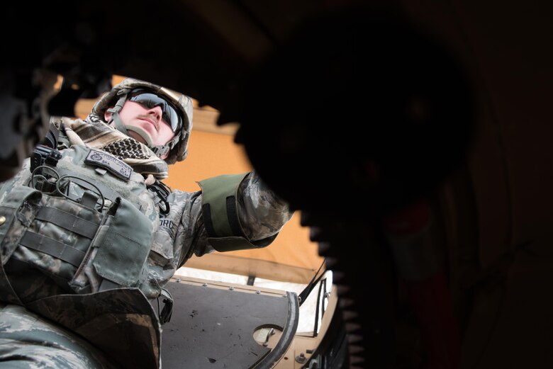 Senior Airman Justyn Headley, 407th Expeditionary Security Forces Squadron, mans the M240B in the turret of a military all-terrain vehicle while on a mobile patrol at the 407th Air Expeditionary Group, March 28, 2017. The security forces squadron is responsible for security of U.S. Air Force, Marine, coalition and host-nation assets.  (U.S. Air Force photo/Master Sgt. Benjamin Wilson)(Released)