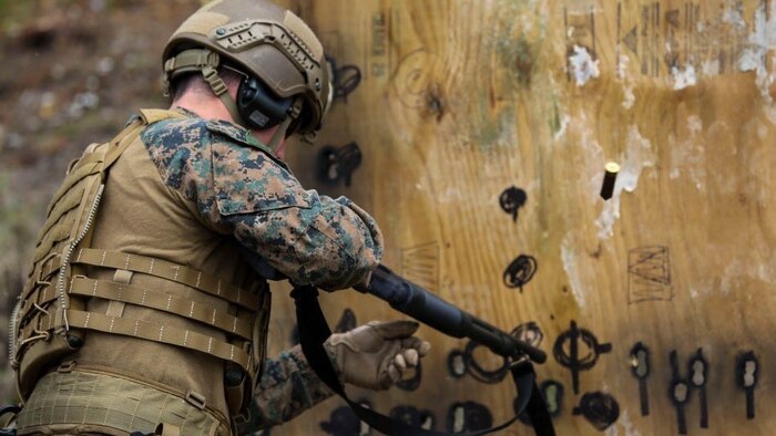HM2 Spencer Eastman reloads a Mossberg 500 shotgun after shooting a round through a simulated door during a breaching exercise at Marine Corps Base Camp Lejeune, N.C., March 29, 2017. The Marines and sailors practiced techniques on how to successfully get through locked doors using shotguns and explosive charges. Eastman is a corpsman with 2nd Reconnaissance Battalion. 