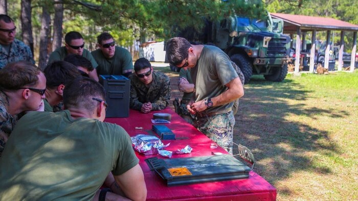 Marines review how to properly set up an explosive charge during a breaching exercise at Marine Corps Base Camp Lejeune, N.C., March 29, 2017. The Marines and Sailors practiced techniques on how to successfully get through locked doors using shotguns and explosive charges. The Marines and Sailors are with 2nd Reconnaissance Battalion. 