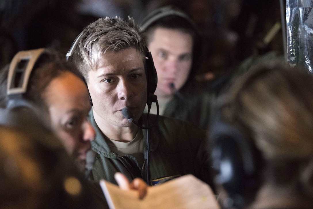 West Virginia Air National Guard Maj. Jodi Pritchard, center, provides feedback during a simulated in-flight emergency aboard an Air Force C-130 Hercules aircraft at McLaughlin Air National Guard Base, Charleston, W.Va., April 2, 2017. Pritchard is a flight nurse assigned to the West Virginia Air National Guard’s 167th Aeromedical Evacuation Squadron, and served as mission crew coordinator overseeing all aeromedical evacuation operations for the mission. Air National Guard photo by Capt. Holli Nelson