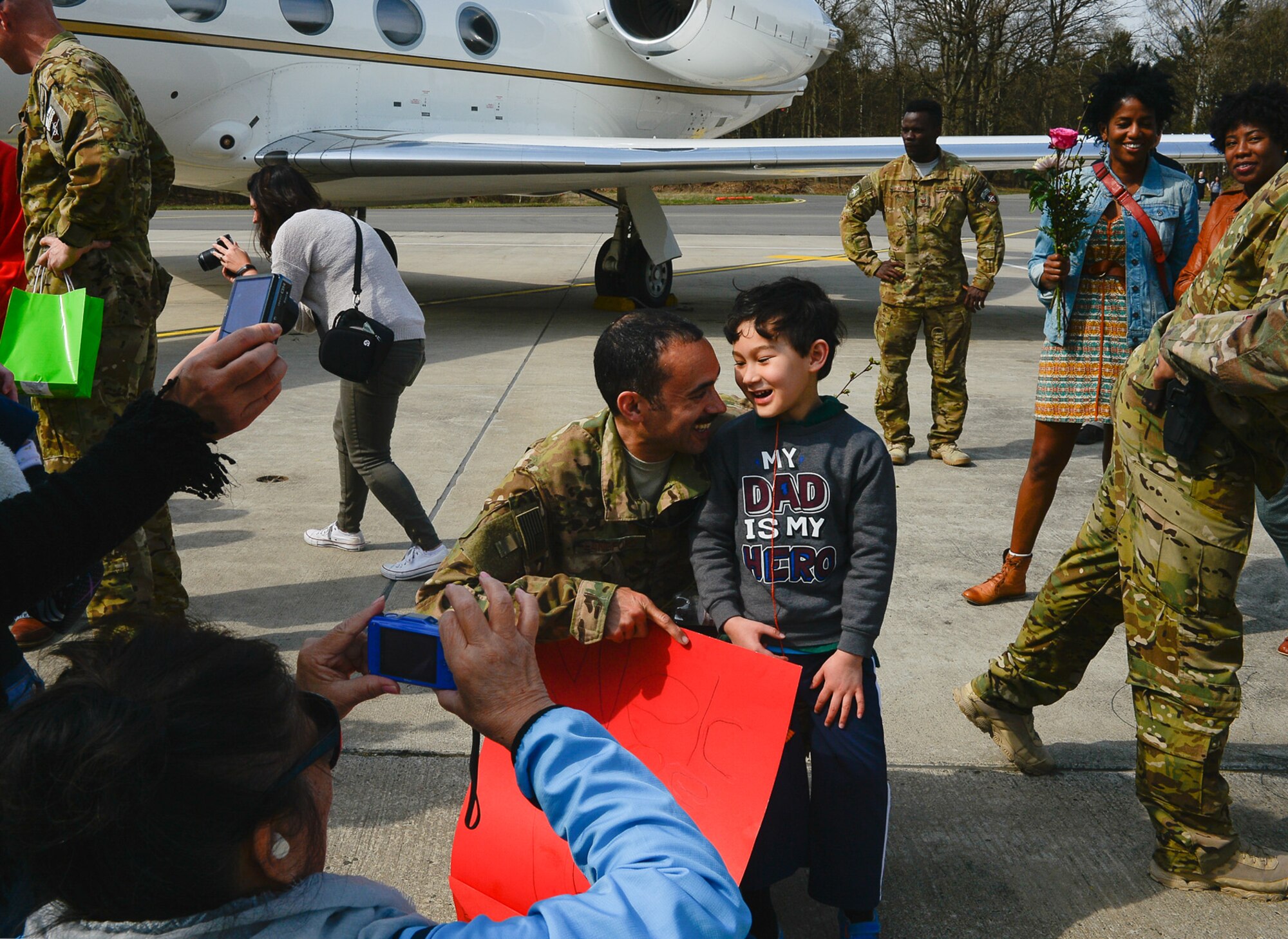 Maj. Anthony Langford, 76th Airlift Squadron pilot, poses for a photo with his son after returning from a deployment on Ramstein Air Base, Germany, April 1st, 2017. Consisting of more than 13,000 military service members, their mission directly impacted Operation Resolute Support, a NATO-led train, advise, and assist mission for the Afghan security forces. (U.S. Air Force photo by Airman 1st Class Joshua Magbanua)