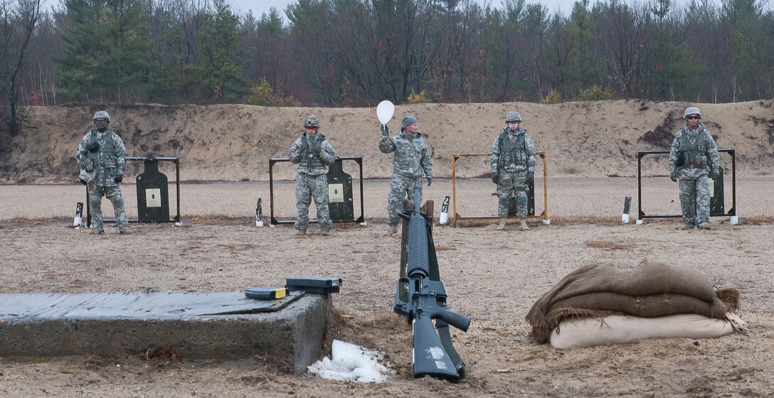 Soldiers return from checking their zero targets during the Best Warrior Competition at Fort Devens on April 4, 2017.