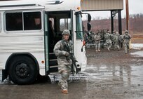 A Soldier excitedly exits the bus from the zero range to enter marksmanship portion, pop-up target event of the Best Warrior Competition at Fort Devens on April 4, 2017.