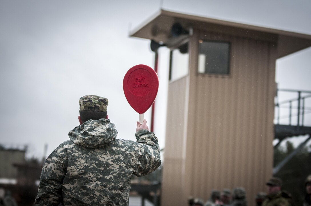 U.S. Army Master Sgt. Gregory Porter signals the control tower at the rifle range, here, while contestants for the 80th Training Command and 99th Regional Support Command’s Best Warrior Competition zero their weapons in preparation for the qualification range April 4, 2017.