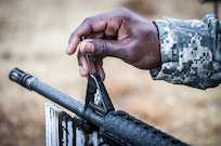 A soldier adjusts his M16-A2’s front sight post at the rifle range, here, during the 80th Training Command and 99th Regional Support Command’s Best Warrior Competition April 4, 2017.