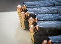 Rain covered M9 bullets and magazines lie ready for a soldier to fire during a qualification range, here, as part of the 80th Training Command and 99th Regional Support Command’s Best Warrior Competition April 4, 2017.
