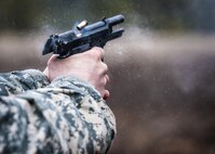 U.S. Army Staff Sgt. Joshua Deiss, a competitor in the 80th Training Command and 99th Regional Support Command’s Best Warrior Competition, fires an M9 pistol during a qualification range, here, April 4, 2017.