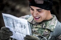 Sergeant 1st Class Jorge Gonzalez checks his map during the daytime land navigation portion of the 80th Training Command and 99th Regional Support Command’s combined Best Warrior Competition April 5, 2017.