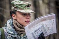 U.S. Army Sergeant Nicole Paese, a public affairs specialist with the 361st Press Camp Headquarters, checks her map during the daytime land navigation portion of the 80th Training Command and 99th Regional Support Command’s combined Best Warrior Competition April 5, 2017.