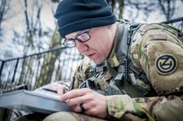 U.S. Army Staff Sgt. Joshua Deiss, plots his points during the daytime land navigation portion of the 80th Training Command and 99th Regional Support Command’s combined Best Warrior Competition April 5, 2017.