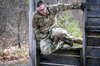 U.S. Army Staff Sgt. Joshua Deiss climbs through an obstacle at the 80th Training Command and 99th Regional Support Command’s combined Best Warrior Competition April 5, 2017.