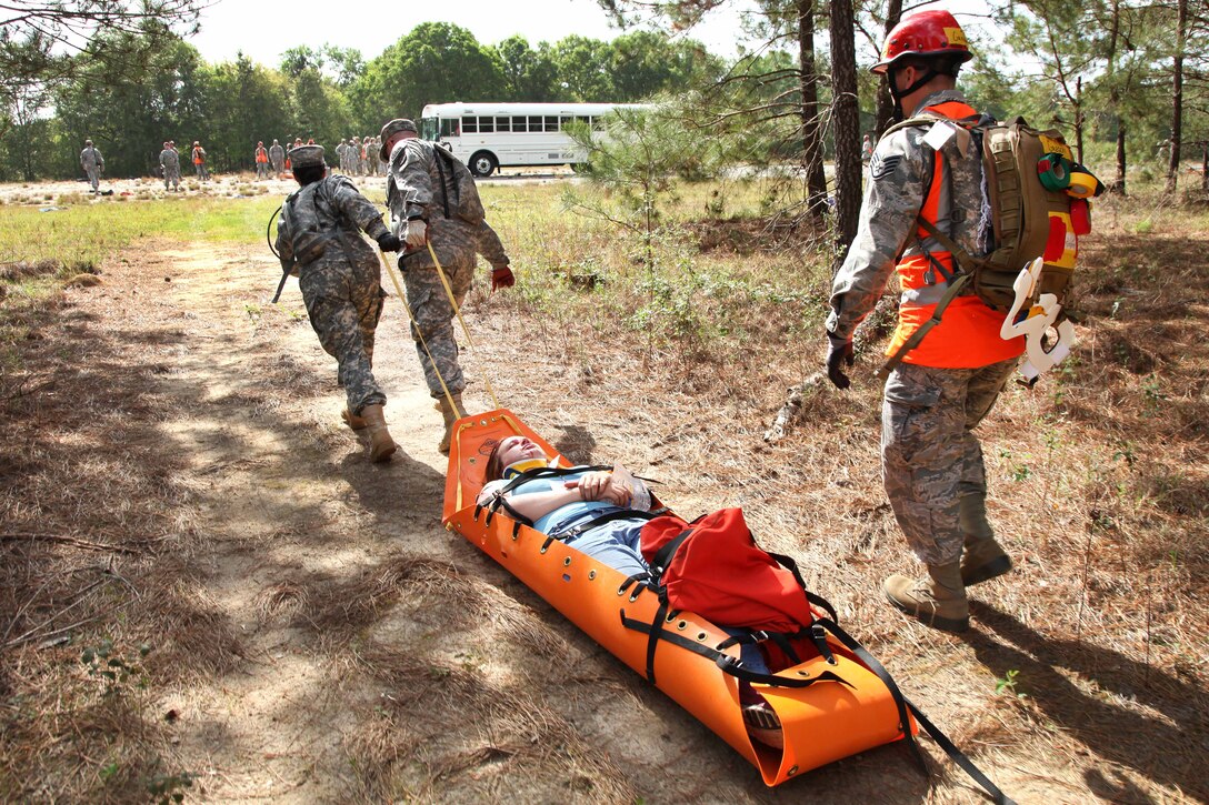 Alabama Army and Air National Guardsmen extract a mock casualty during operation Vigilant Guard in Tifton, Ga., March 28, 2017. The soldier and airmen are assigned to the Alabama Air National Guard’s 440th Chemical Company and 187th Medical Group. Army photo by Spc. Josue Mayorga