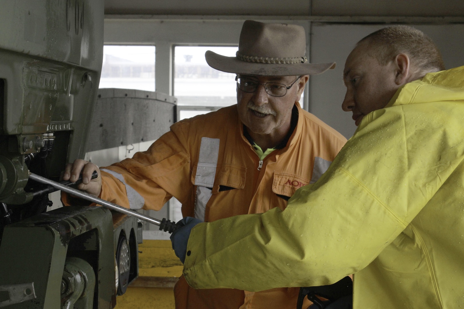 Spc. Seth Morgenstern, right, of the New York National Guard, and a biological security officer from the Department of Agriculture and Water Resources of Australia, cleanse the microorganisms from a military vehicle Mar. 29, 2017, at Joint Base Lewis-McChord, Wash.  Members of the NYNG are helping to prevent the spread of possible foreign microorganisms to Australia on vehicles to be shipped for Exercise Talisman Sabre 2017 later this year. 