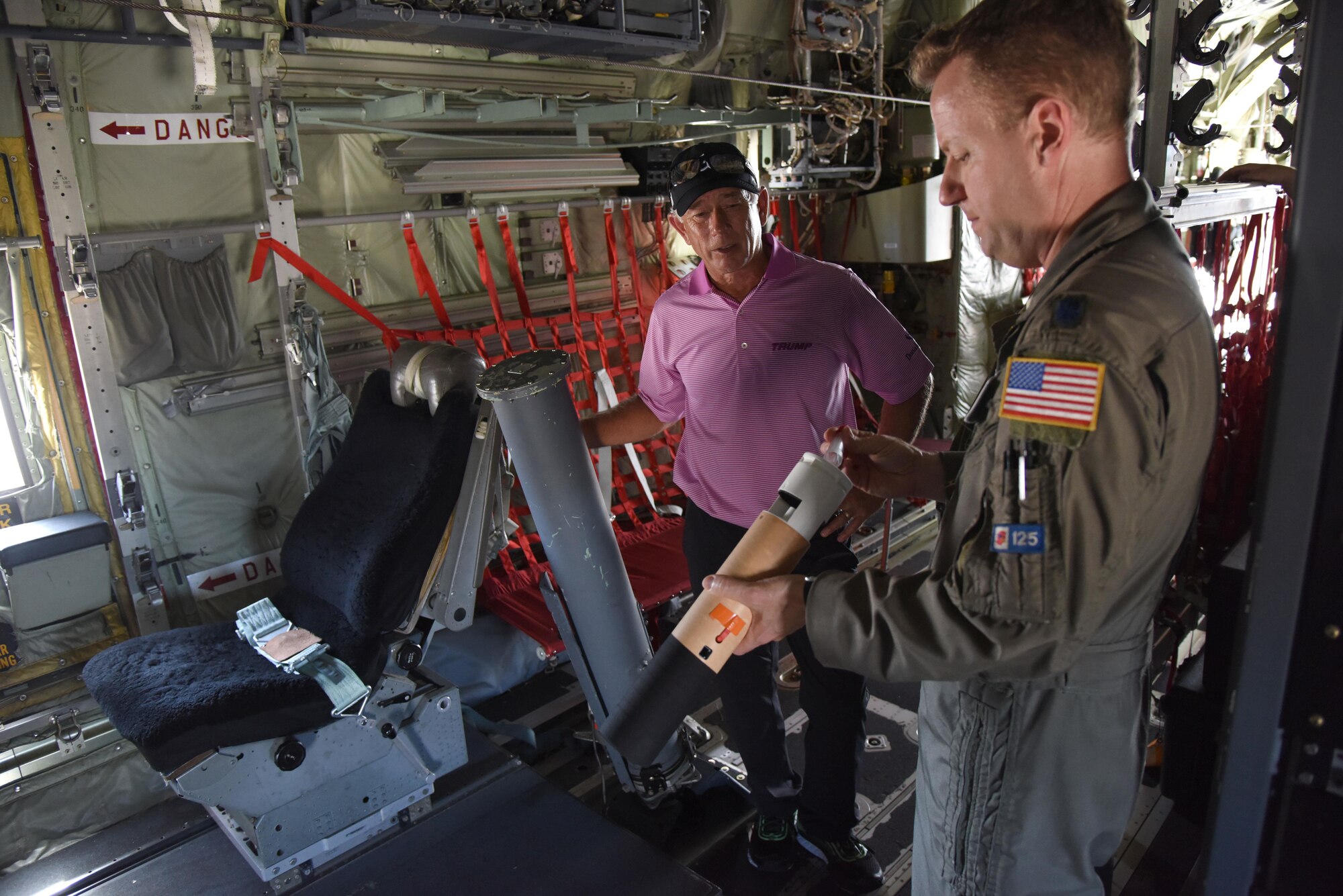 Lt. Col. Sean Cross, 53rd Weather Reconnaissance Squadron instructor pilot, provides a tour of a WC-130J Hercules to Mike Goodes, Senior Professional Golfers’ Association player, March 29, 2017, on Keesler Air Force Base, Miss. Goodes, who participated in the Annual Mississippi Resort Golf Classic last week, also received a windshield tour of Keesler and a Science on a Sphere demonstration. (U.S. Air Force photo by Kemberly Groue)