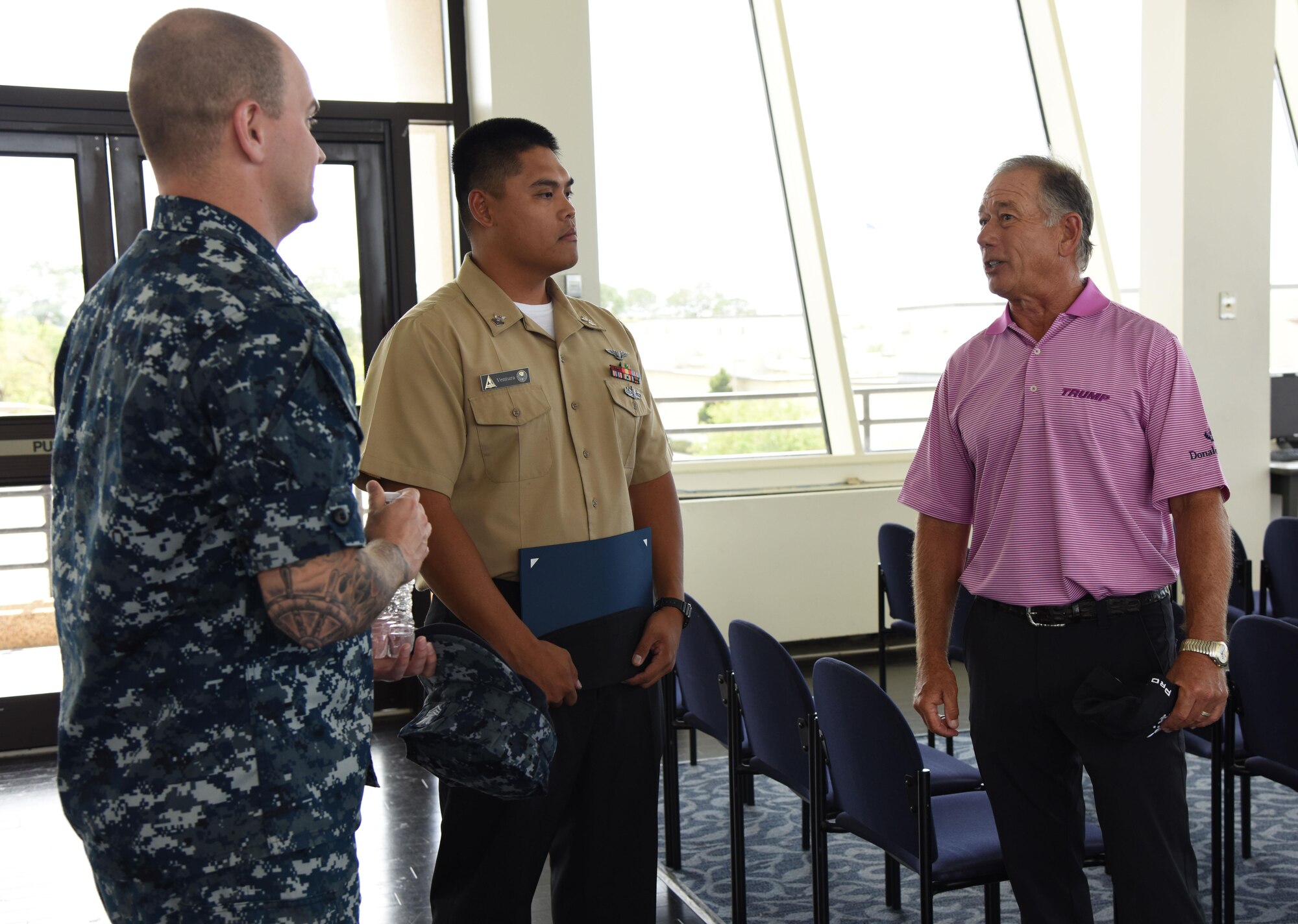 Mike Goodes, Senior Professional Golfers’ Association player, speaks with U.S. Navy Petty Officers 1st Class Ian Smith and Paul Ventura, Center for Naval Aviation Technical Training Unit Keesler instructors, during a tour of the Weather Training Complex March 29, 2017, on Keesler Air Force Base, Miss. Goodes, who participated in the 2017 Mississippi Resort Golf Classic, also received a windshield tour of Keesler and viewed a WC-130J Hercules static display. (U.S. Air Force photo by Kemberly Groue)