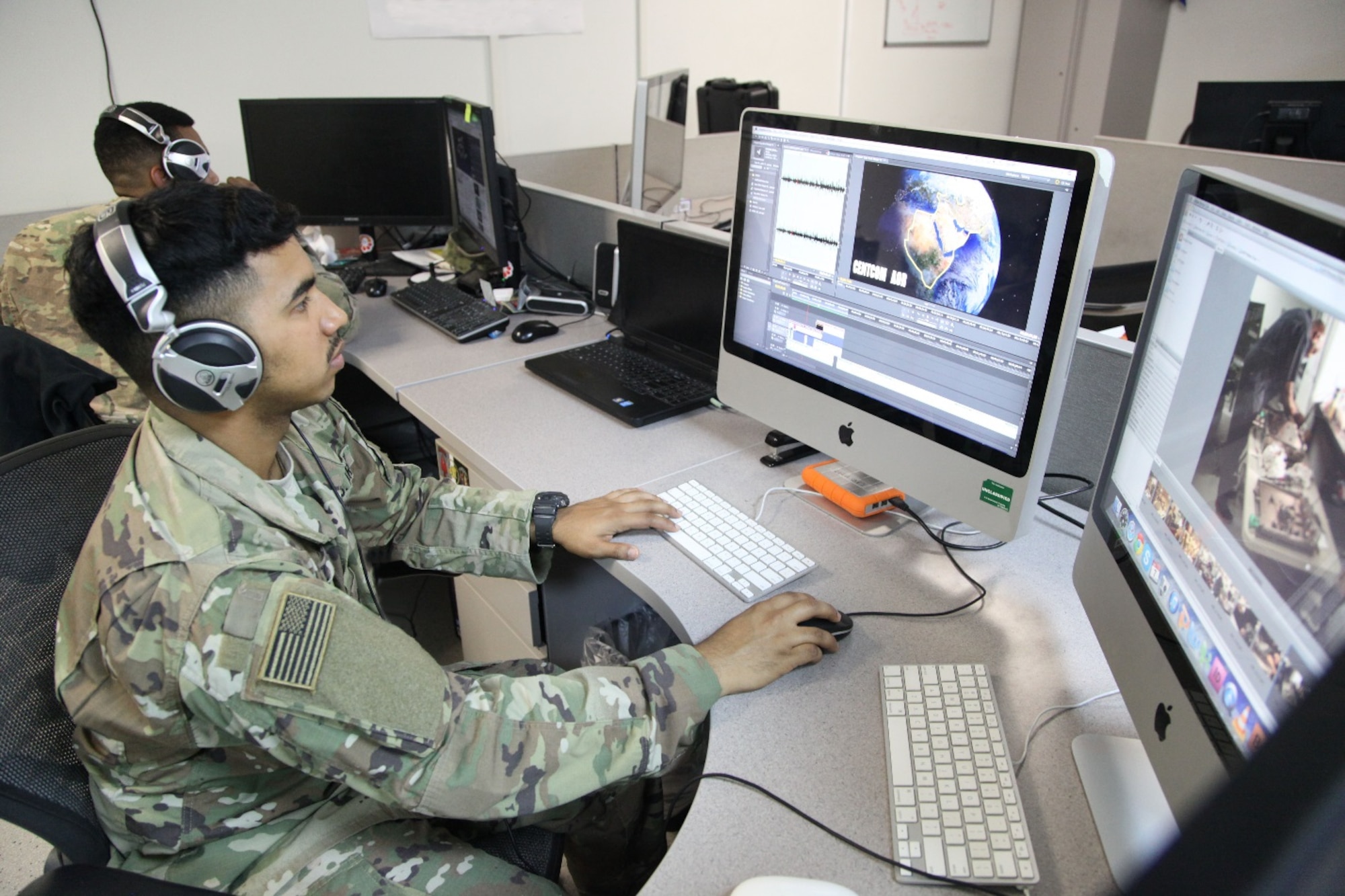 U.S. Army Spc. Jose edits a video on Feb. 9, 2017 at the Military Information Support Task Force-Central (MISTF-C) Headquarters on Al Udeid Air Base, Qatar. Jose is assigned to the Production Development Detachment within the MISTF-C. (U.S. Army photo by Staff Sgt. Brian)