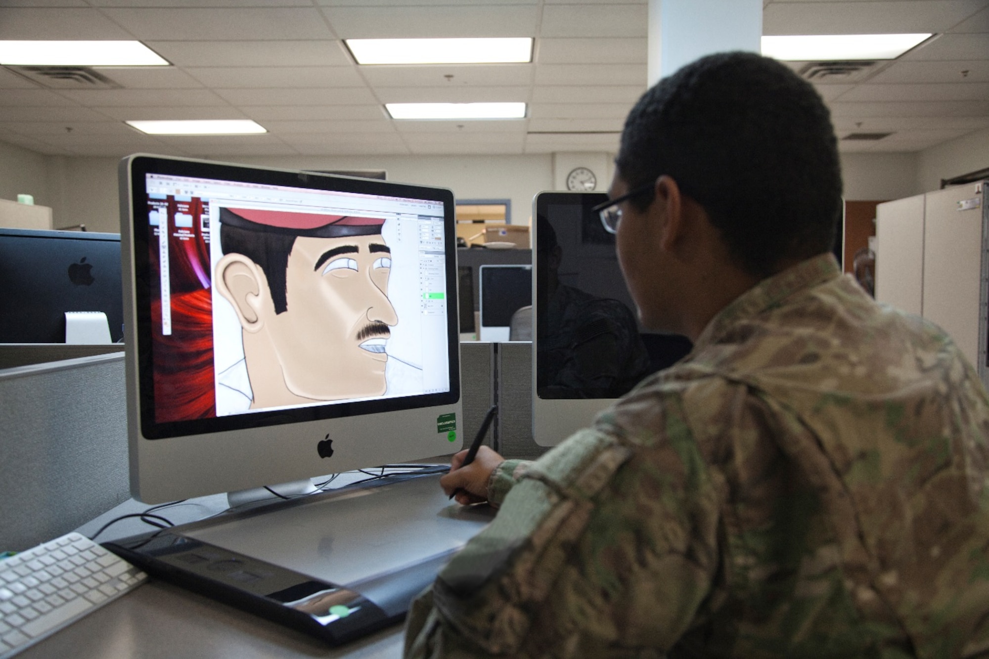 U.S. Army Spc. James edits an illustration on Nov. 3, 2016, at the Military Information Support Task Force-Central (MISTF-C) on Al Udeid Air Base, Qatar. James is a 25M Multi-Media Graphic Illustrator assigned to the MISTF-C as a member of the Product Development Detachment. (U.S. Army photo by Staff Sgt. Brian)