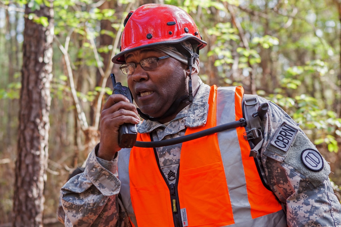 Alabama Army National Guard Staff Sgt. Carlton Wright Jr., communicates the locations of mock causalities to rescue personnel during Operation Vigilant Guard in Tifton, Ga., March 28, 2017. Wright is assigned to the Alabama Air National Guard’s 440th Search and Extraction Team. Army photo by Spc. Jesse Coggins