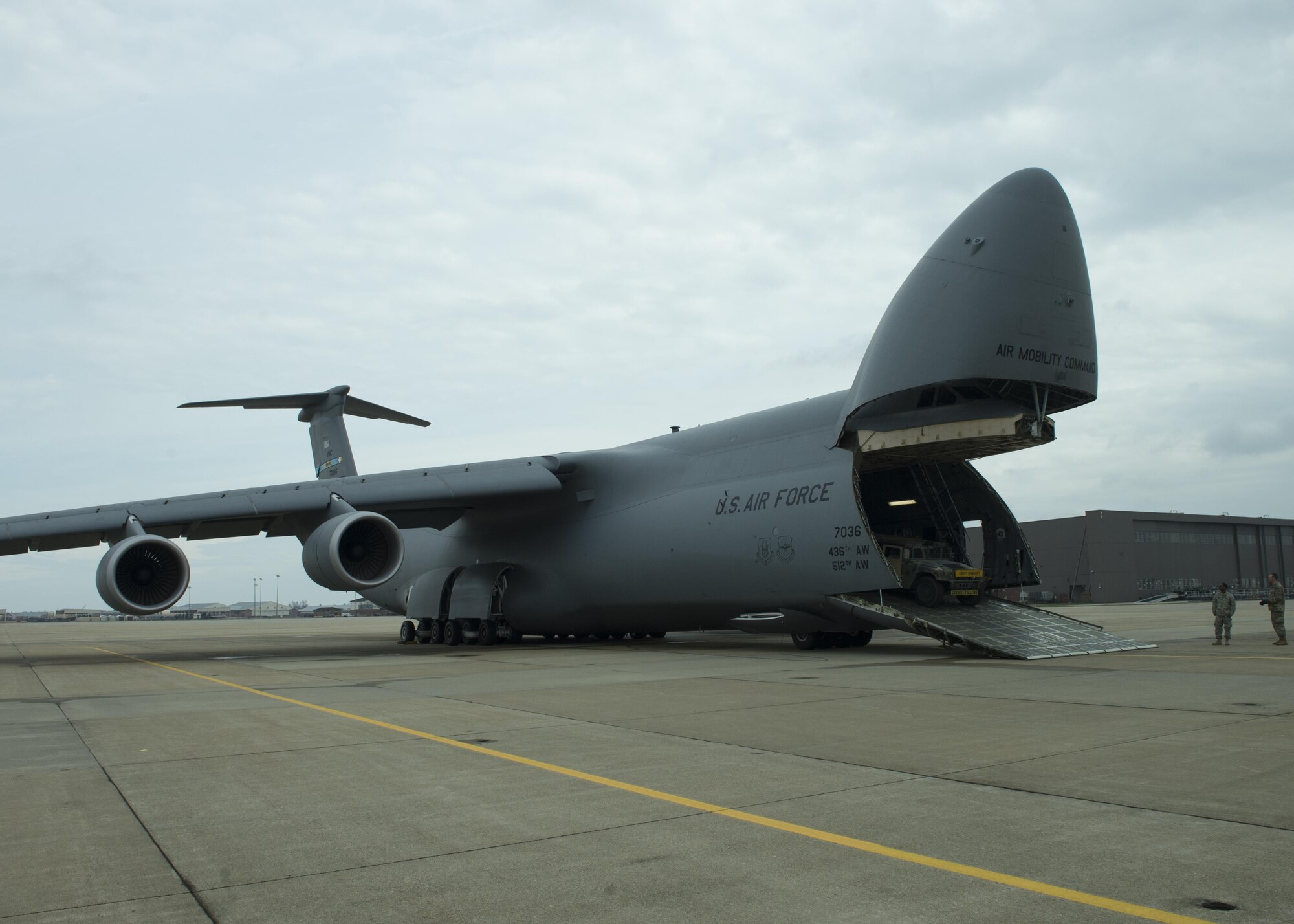Airmen and Soldiers load a C-5M Super Galaxy during a joint emergency deployment exercise, Joint Base Langley-Eustis, March 18, 2017. The 709th Airlift Squadron flew from Dover Air Force Base, Del. to work with the 302nd Inland Cargo Transfer Company for the exercise. (U.S. Air Force photo/ Tech. Sgt. Mercedes Crossland)